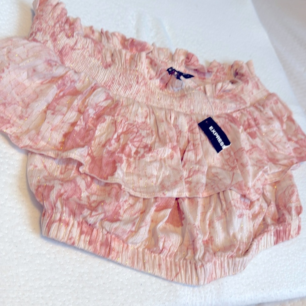 A pink blouse for women size medium the brand is Express